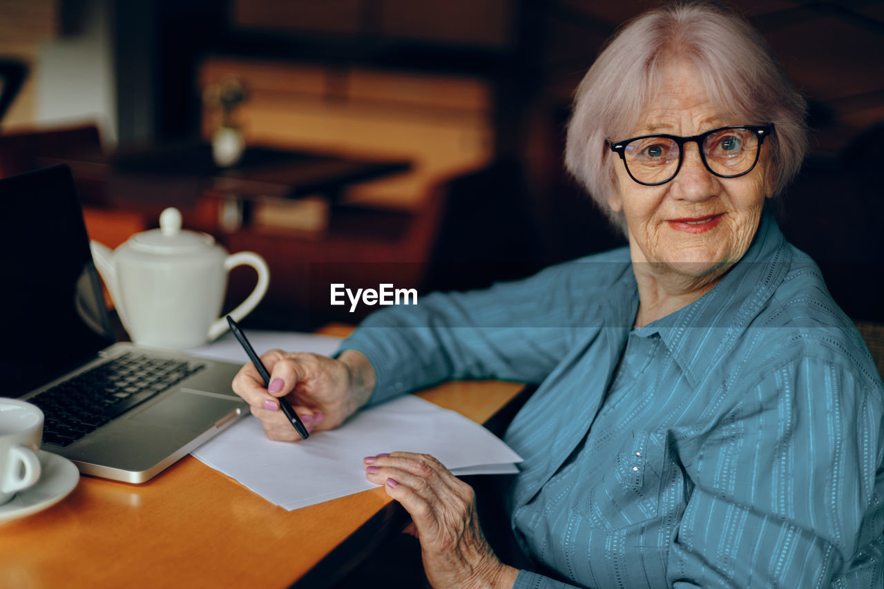 Portrait of senior woman wearing eyeglasses