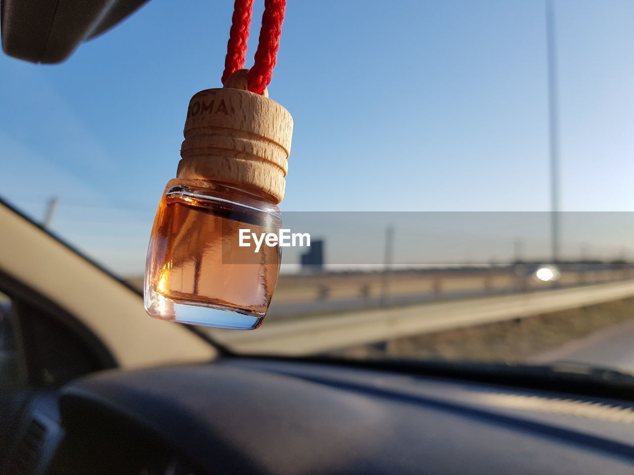 CLOSE-UP OF ELECTRIC LAMP AGAINST SKY