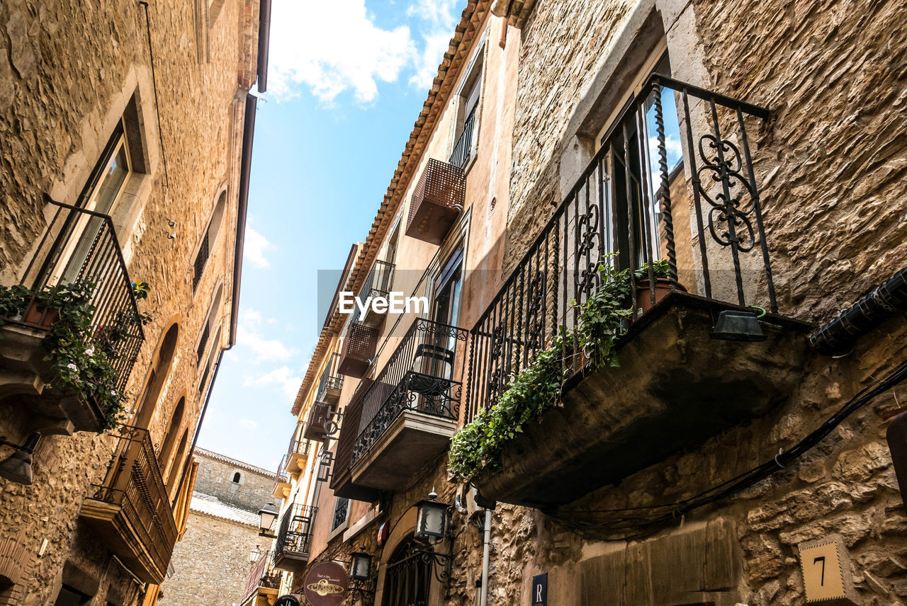 Low angle view of old buildings against sky