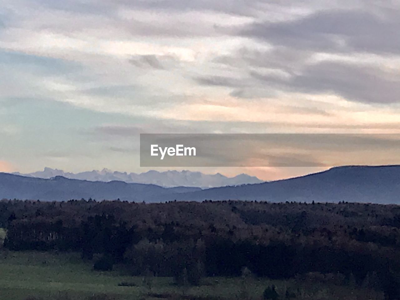 SCENIC VIEW OF LANDSCAPE AND MOUNTAINS AGAINST SKY