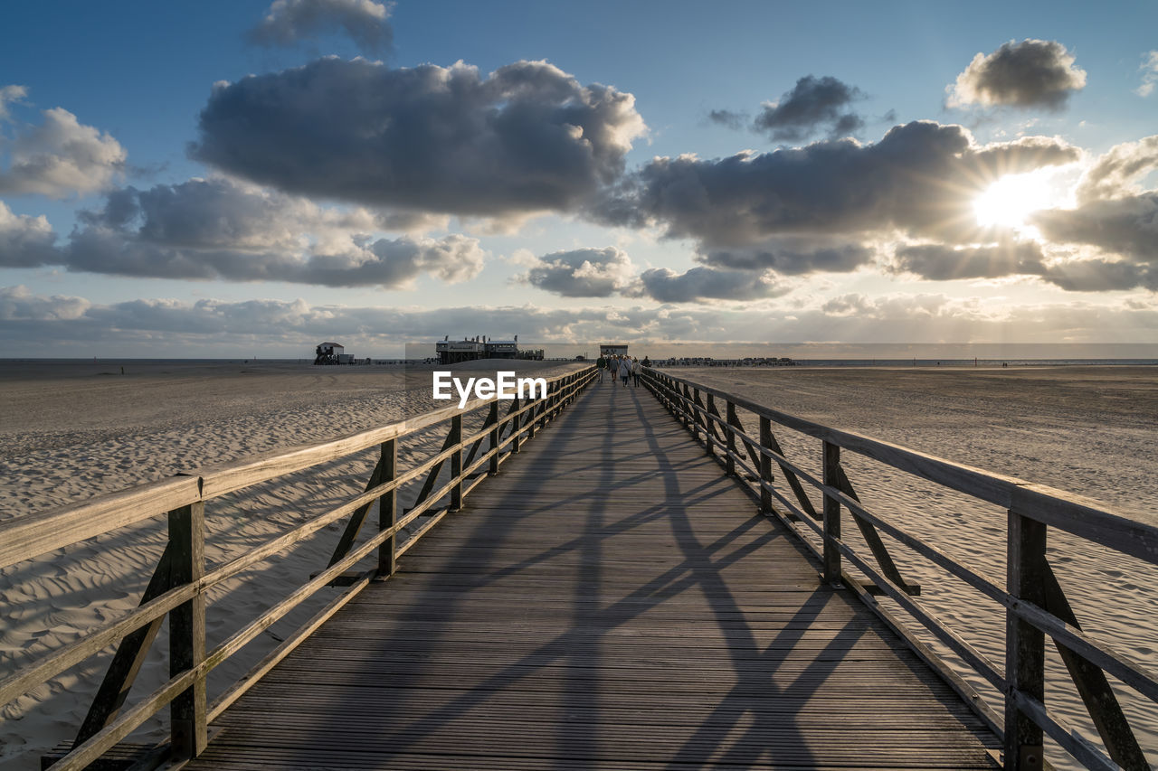 Panoramic view of empty beach against sky during sunset