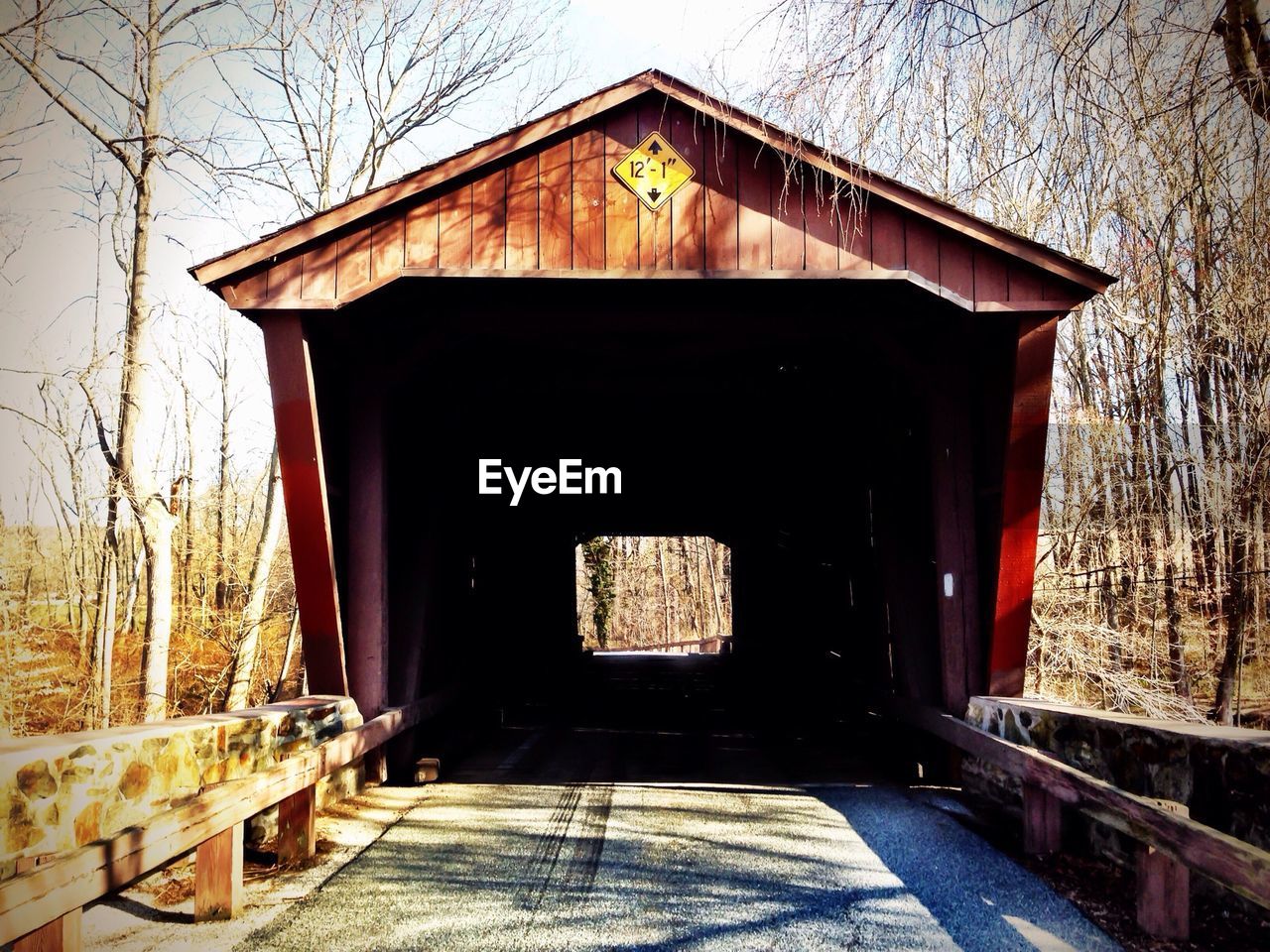 Empty built structure against bare trees