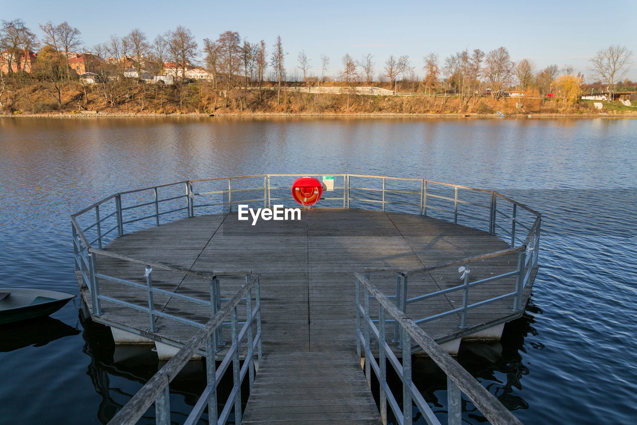 Pier over lake against sky