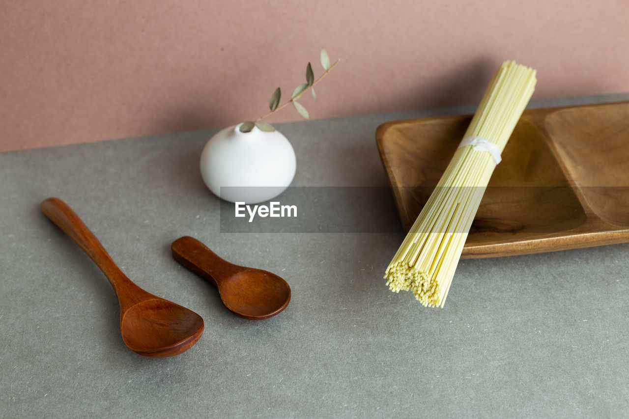 food, indoors, food and drink, wood, no people, studio shot, still life, tableware, kitchen utensil, high angle view, wellbeing, healthy eating, simplicity, wooden spoon, table, freshness, household equipment, spoon, ingredient, group of objects, produce