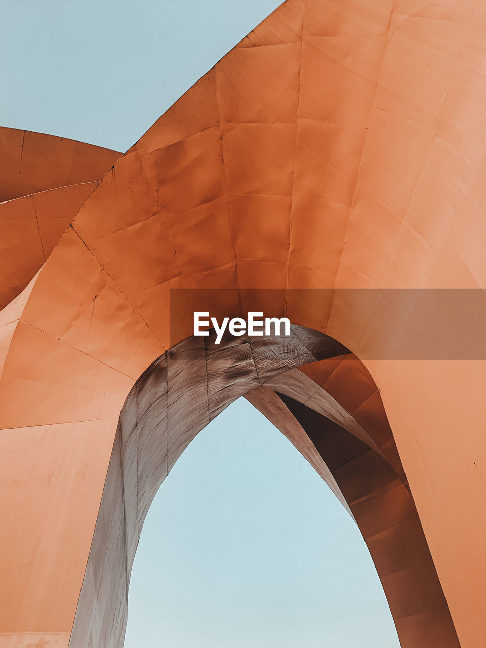 Low angle view of brown built structure against sky