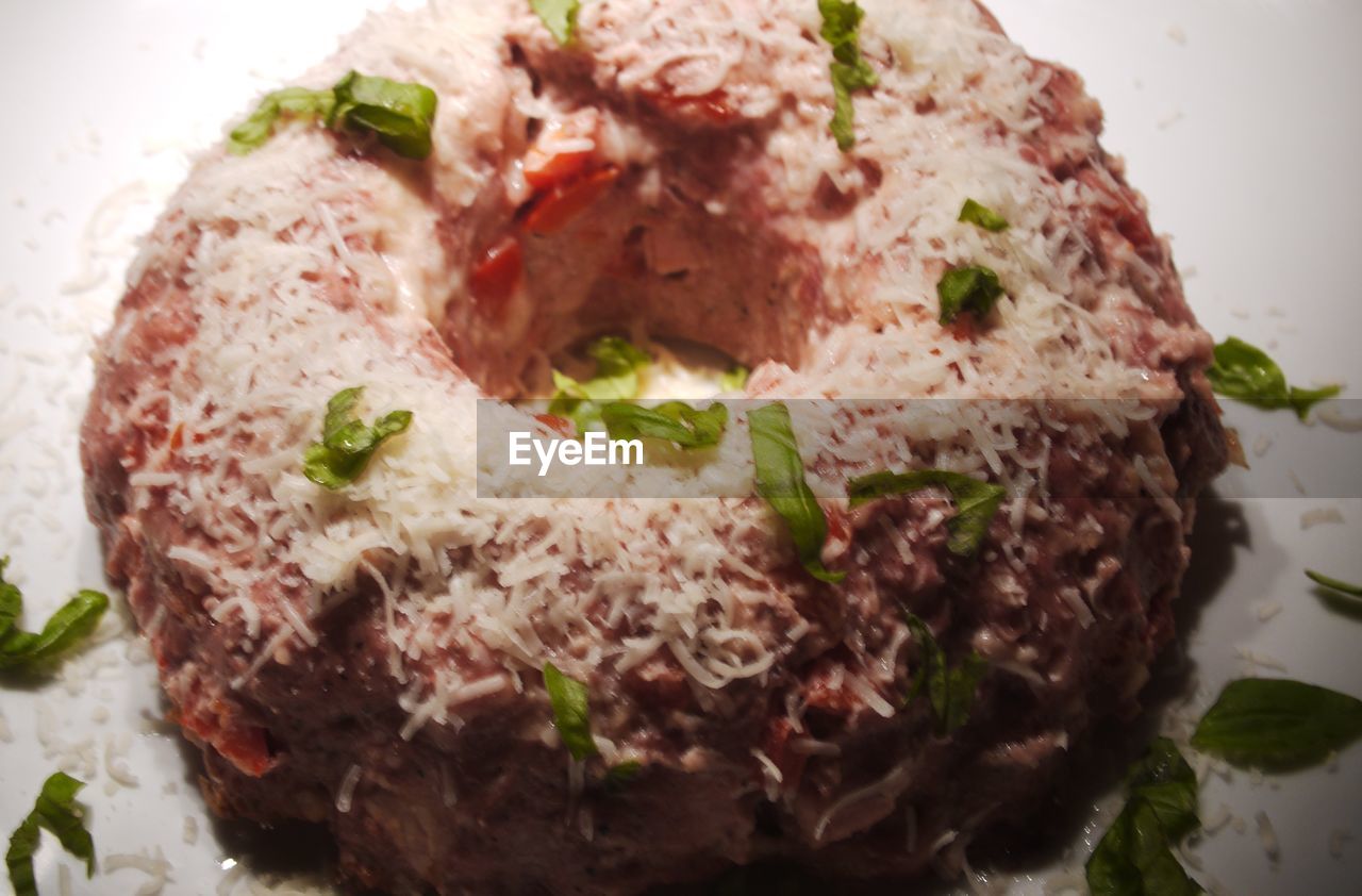 CLOSE-UP OF MEAT WITH BREAD AND VEGETABLES