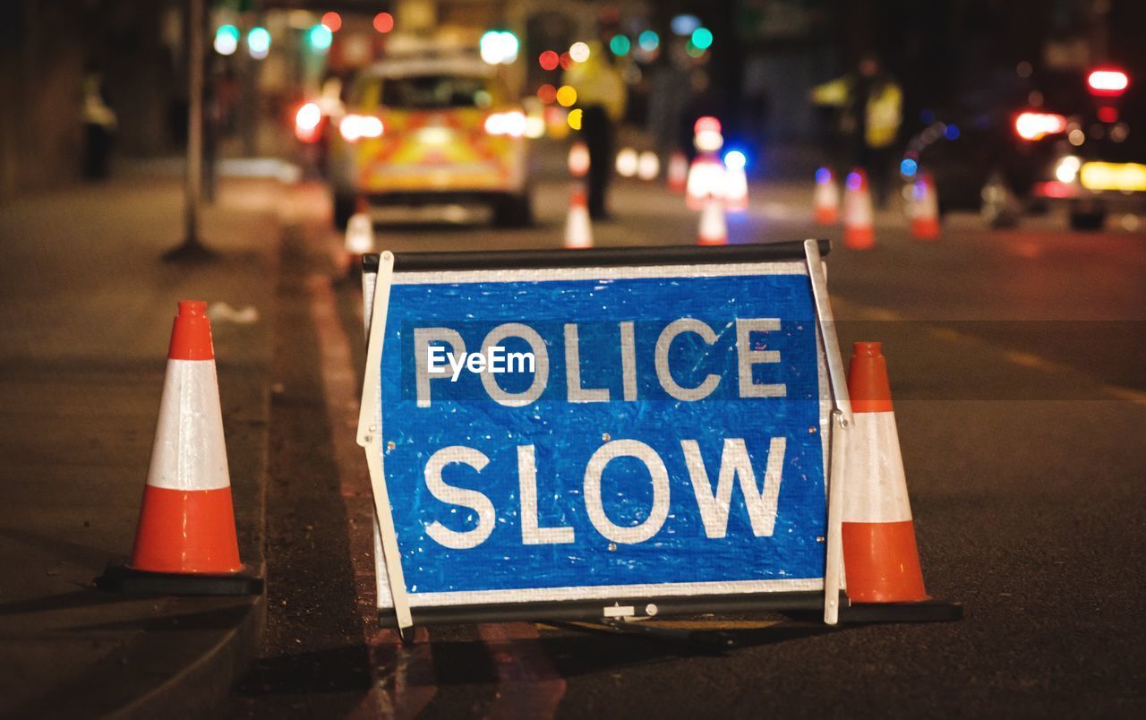 Information sign on road at night