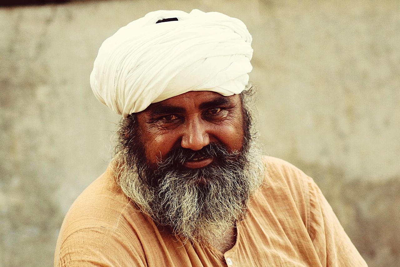 Portrait on bearded man in white turban