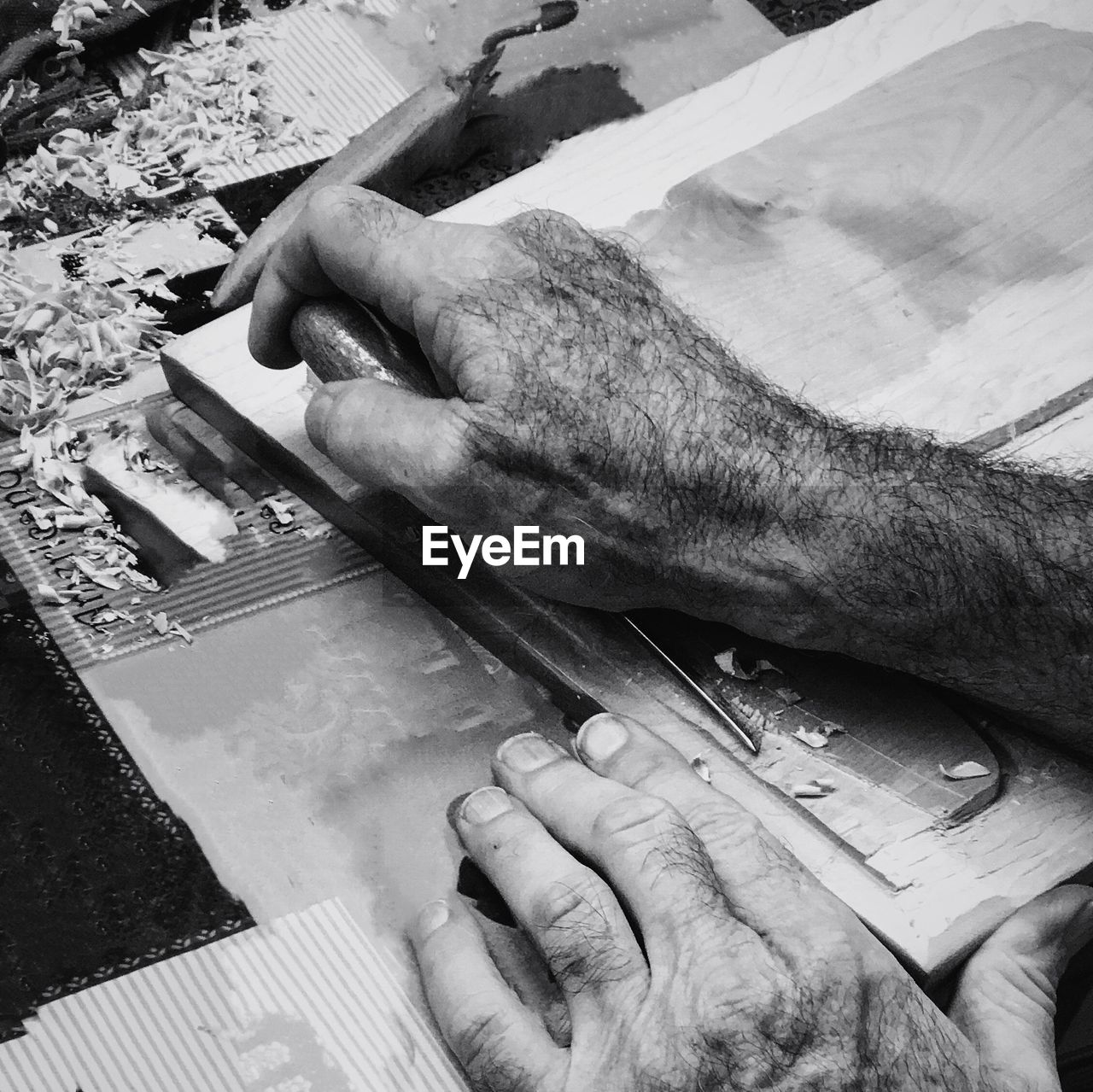 Cropped hands of man working at workshop