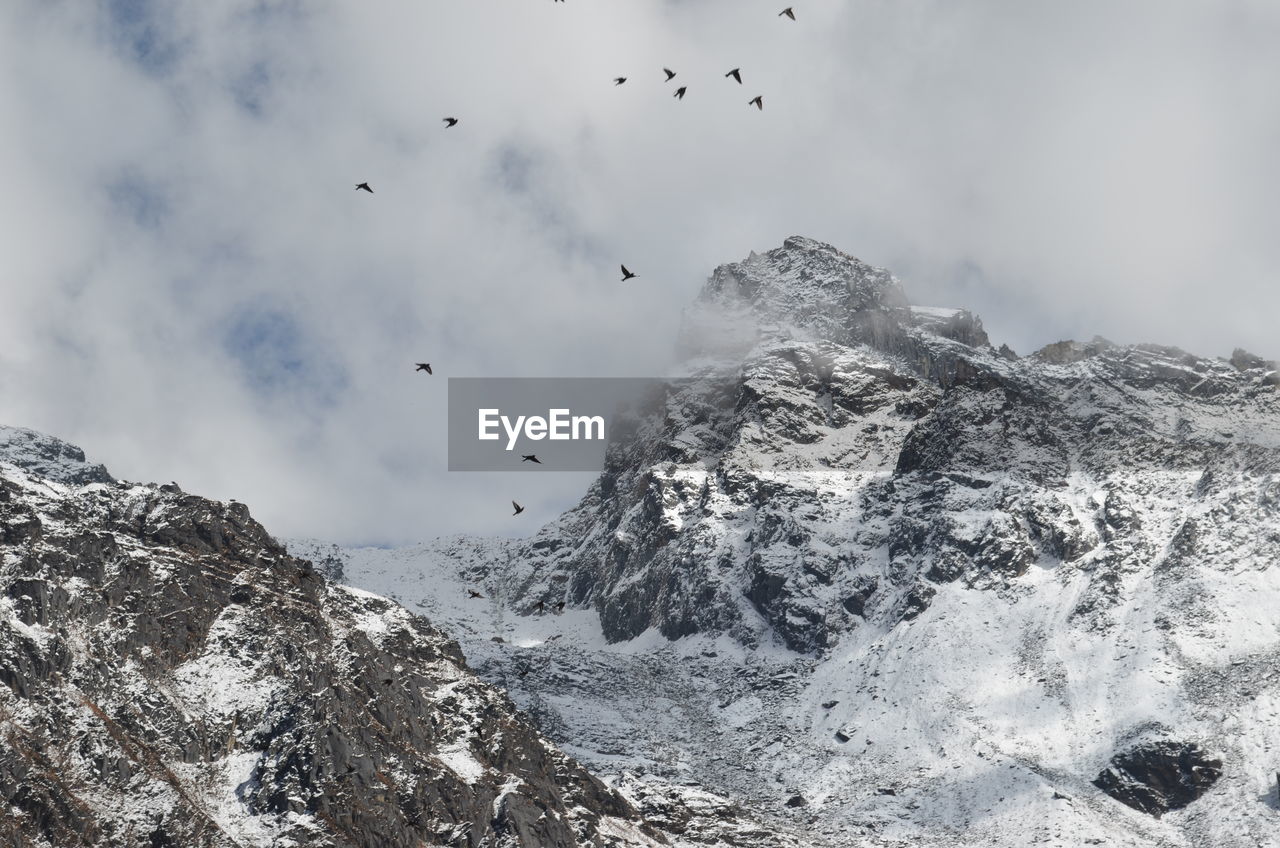 Scenic view of rocky mountains against sky at lachung