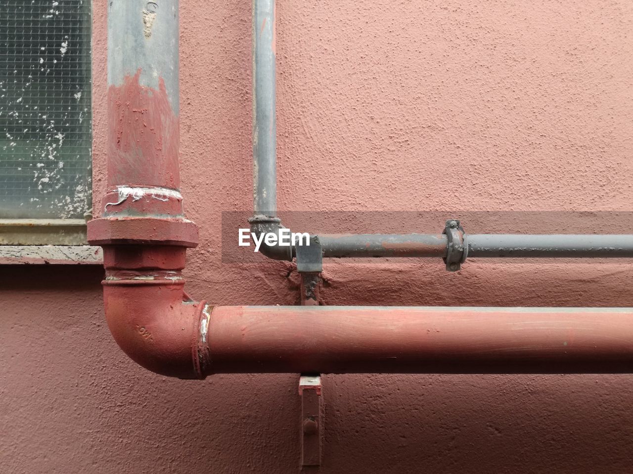 CLOSE-UP OF PIPES ON WALL