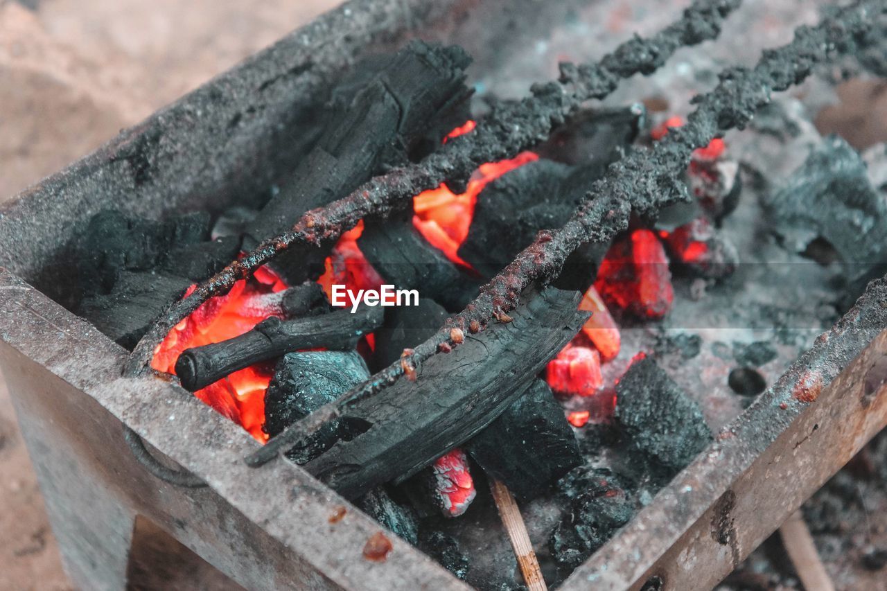 High angle view of fire on wood