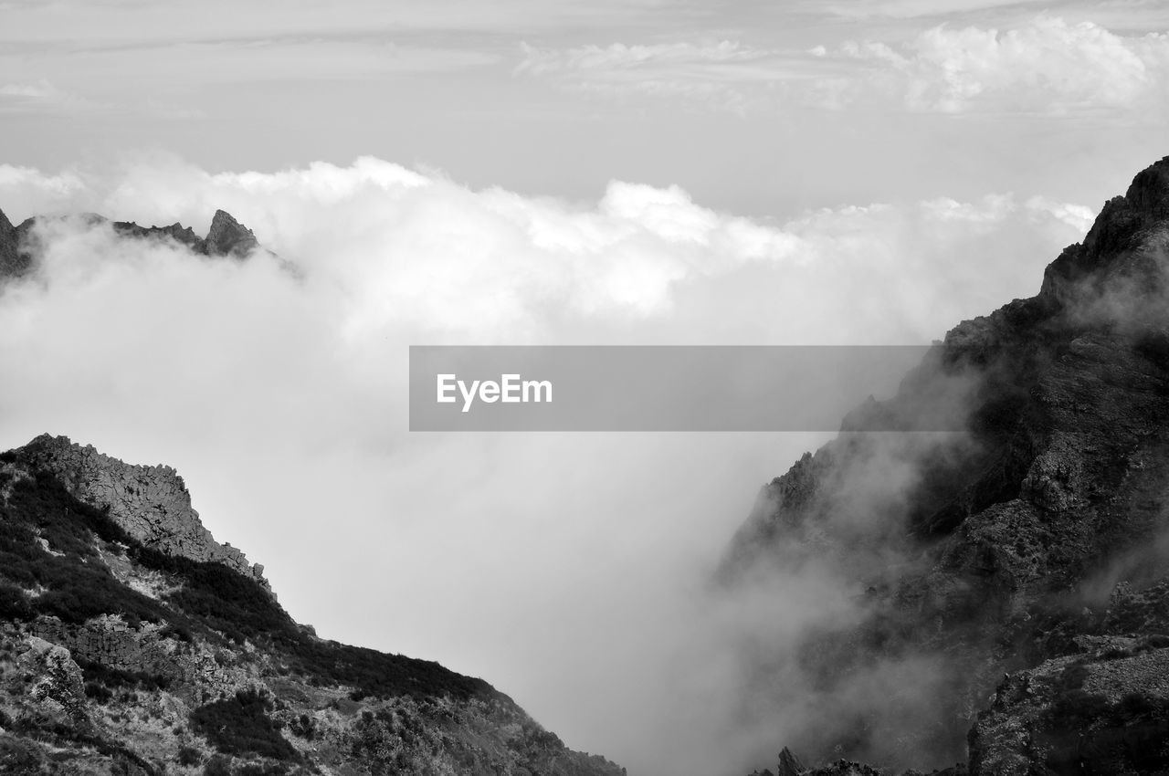 Scenic view of mountains in foggy weather