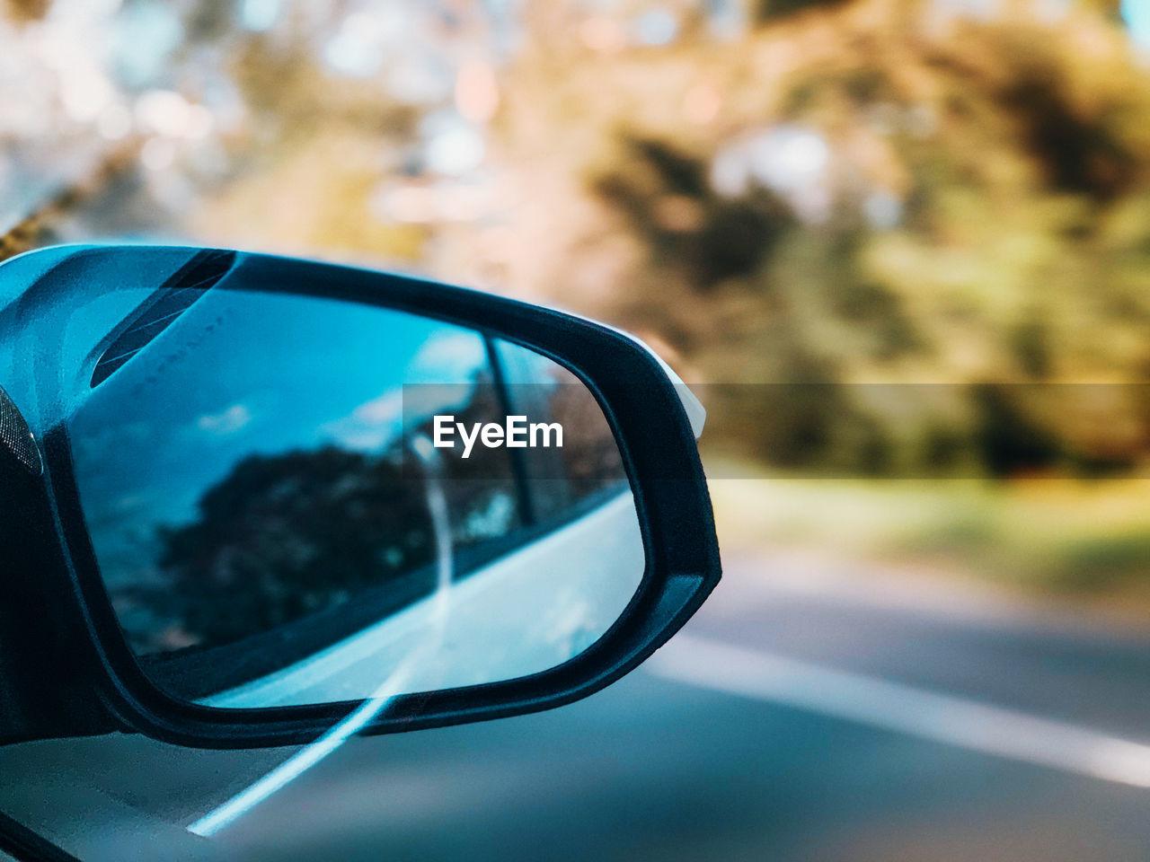 Close-up of reflection on side-view mirror