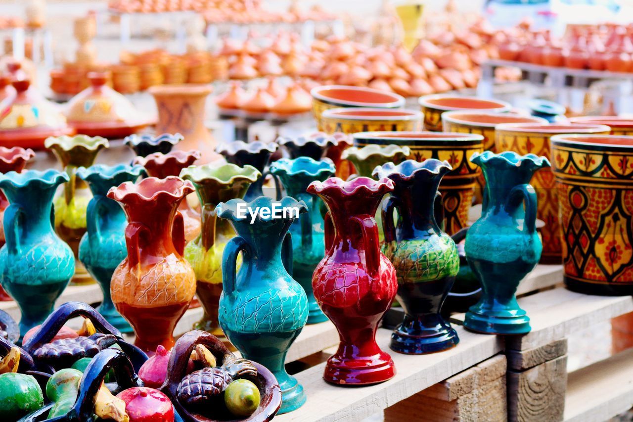 Close-up of various vases for sale in market