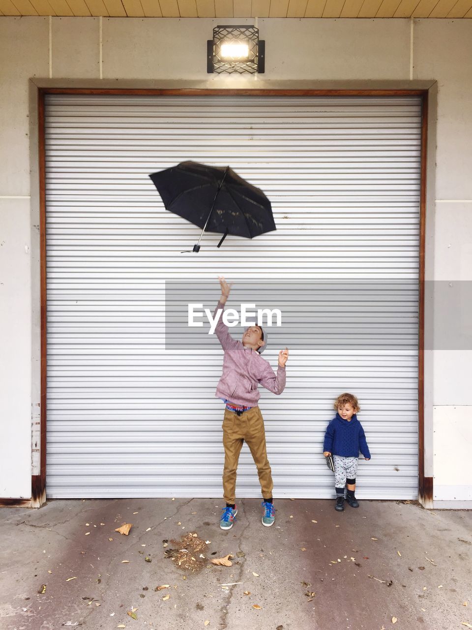 CHILDREN WITH UMBRELLA