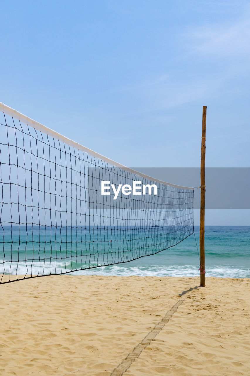 Scenic view of beach against blue sky