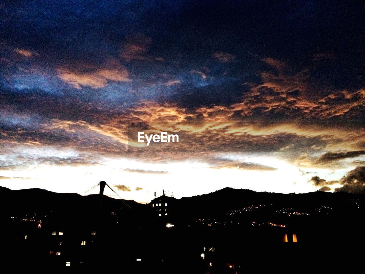 SCENIC VIEW OF CLOUDY SKY OVER SUNSET