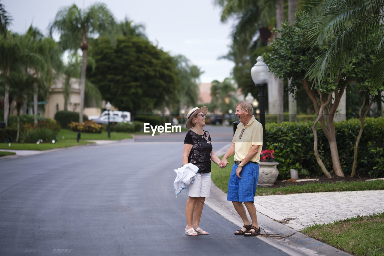 Senior couple walking hand in hand enjoying retirement