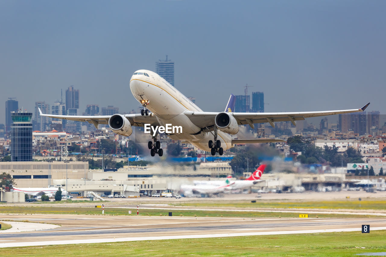 AIRPLANE ON RUNWAY AGAINST SKY