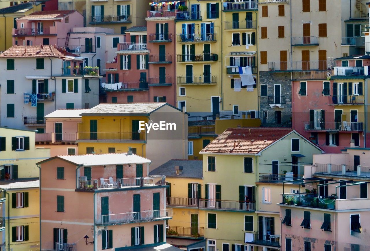 architecture, building exterior, built structure, building, city, neighbourhood, residential district, town, house, residential area, cityscape, community, crowded, apartment, window, urban area, multi colored, nature, travel destinations, crowd, full frame, tourism, old, travel, roof, abstract, outdoors, water, cut out, day, facade, city life, street