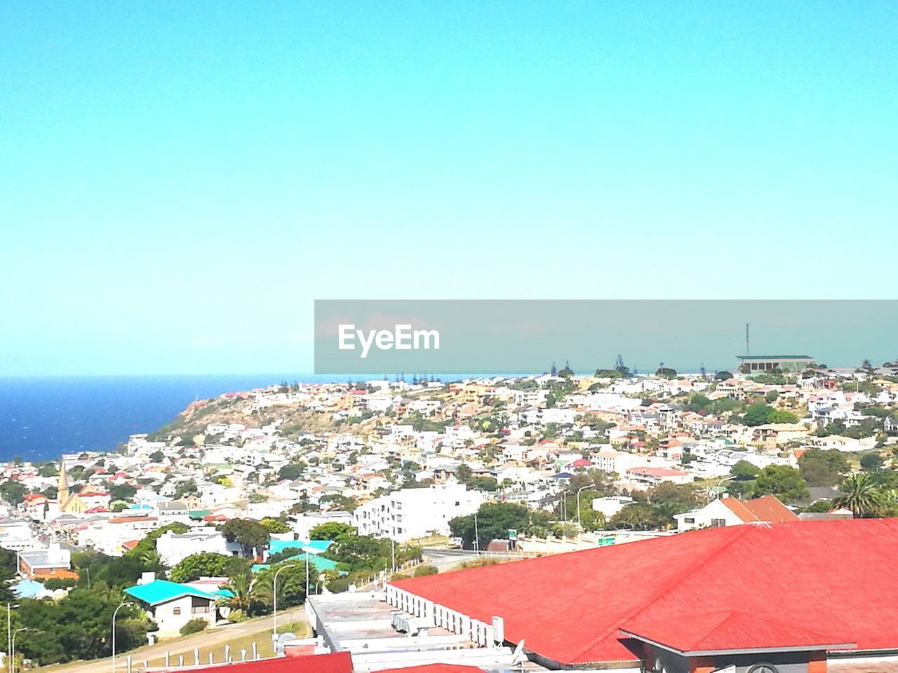 CITYSCAPE AGAINST CLEAR BLUE SKY