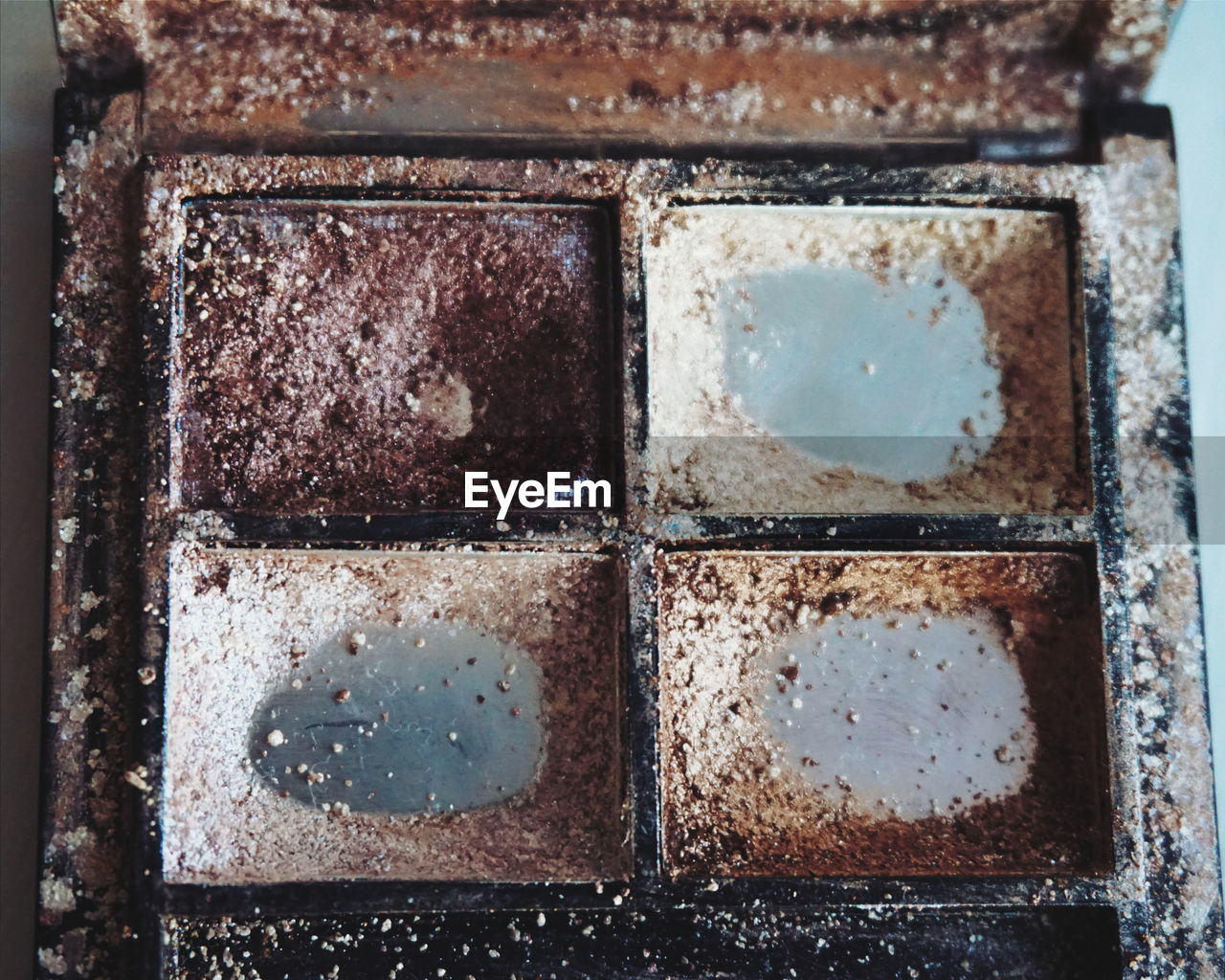 Close-up of abandoned make-up box