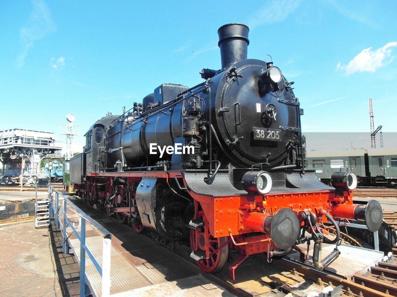 Train on railroad tracks against sky