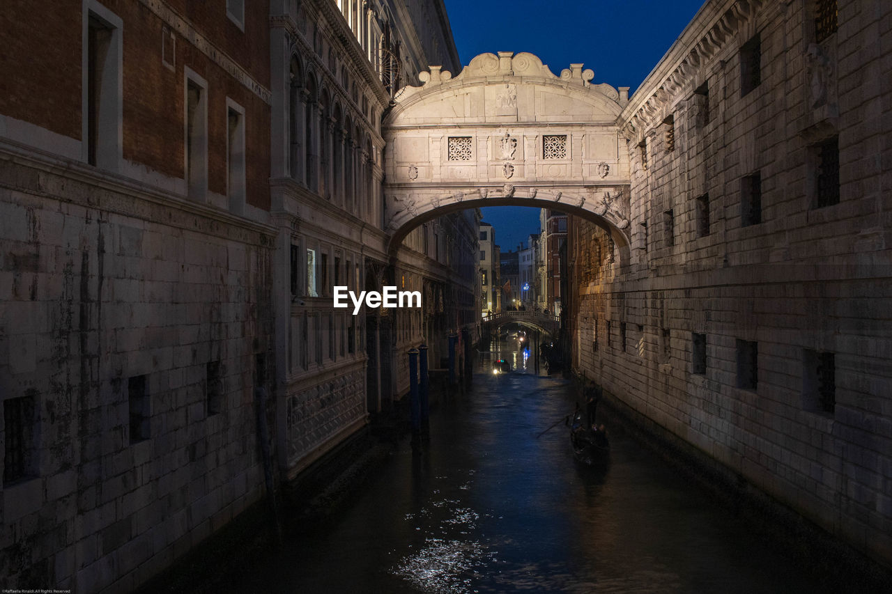 Canal amidst buildings in city