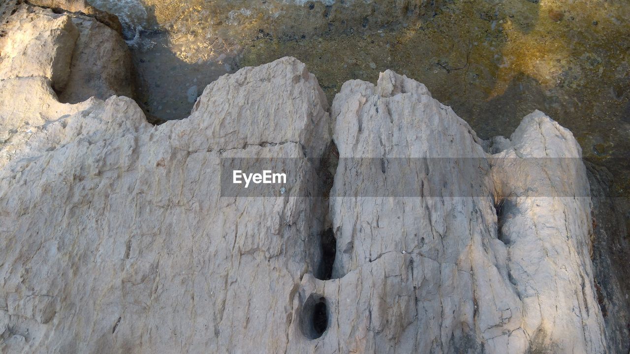 FULL FRAME SHOT OF ROCK FORMATION ON LAND