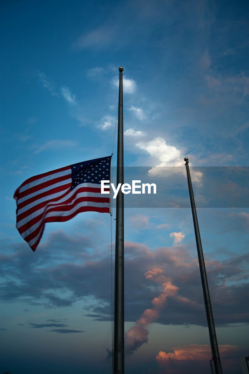 Low angle view of american flag against sky at cape canaveral