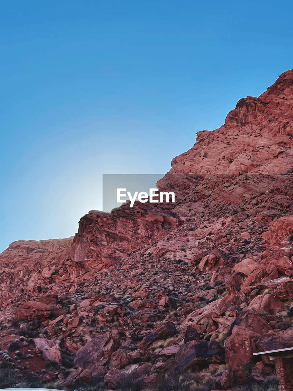 rock, sky, nature, scenics - nature, environment, rock formation, beauty in nature, landscape, travel destinations, mountain, blue, land, no people, travel, clear sky, non-urban scene, desert, geology, red, canyon, outdoors, cliff, tranquility, day, terrain, wadi, tourism, water, tranquil scene, climate, sunny