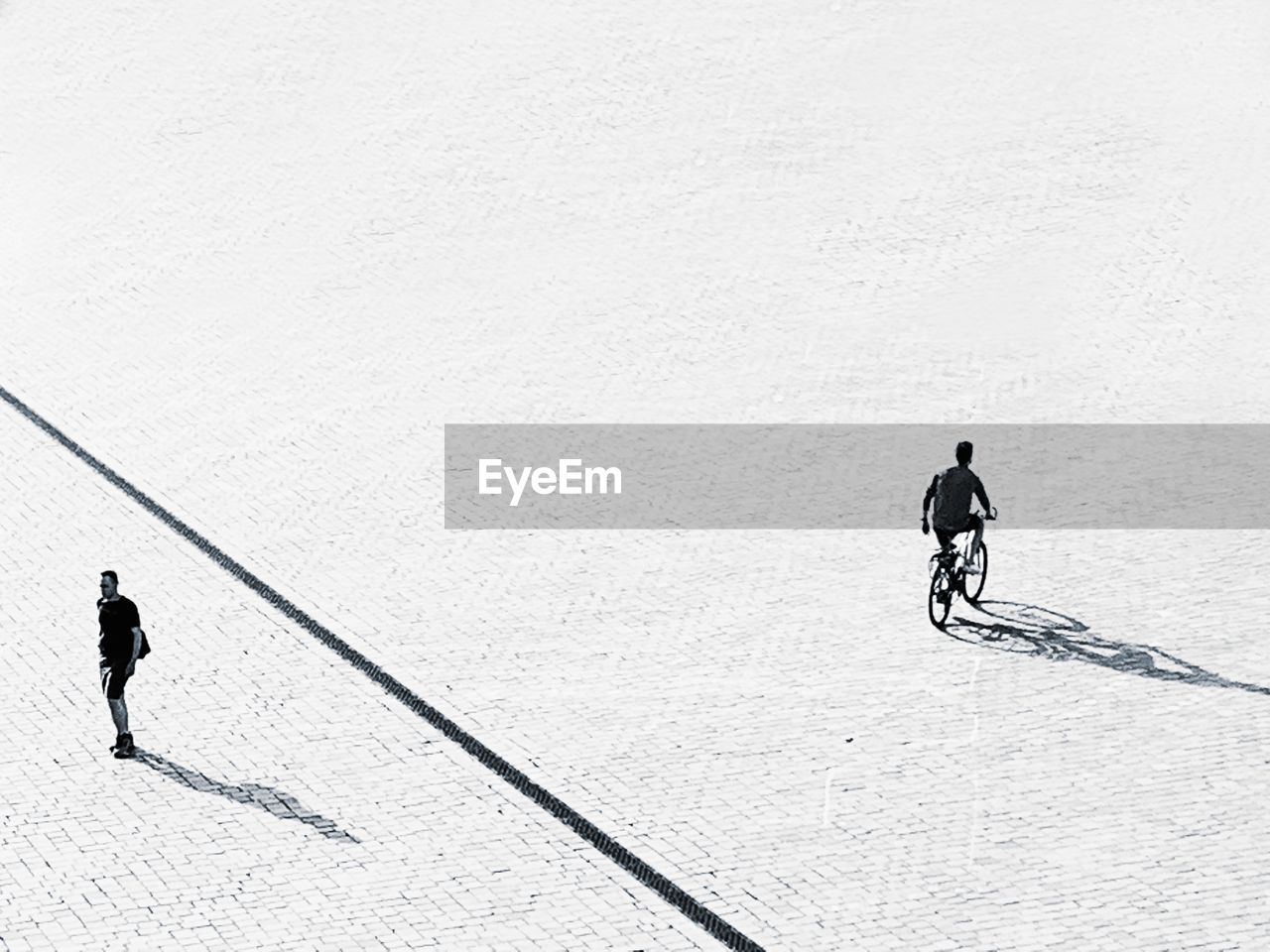 HIGH ANGLE VIEW OF PEOPLE WALKING ON SNOWCAPPED MOUNTAINS