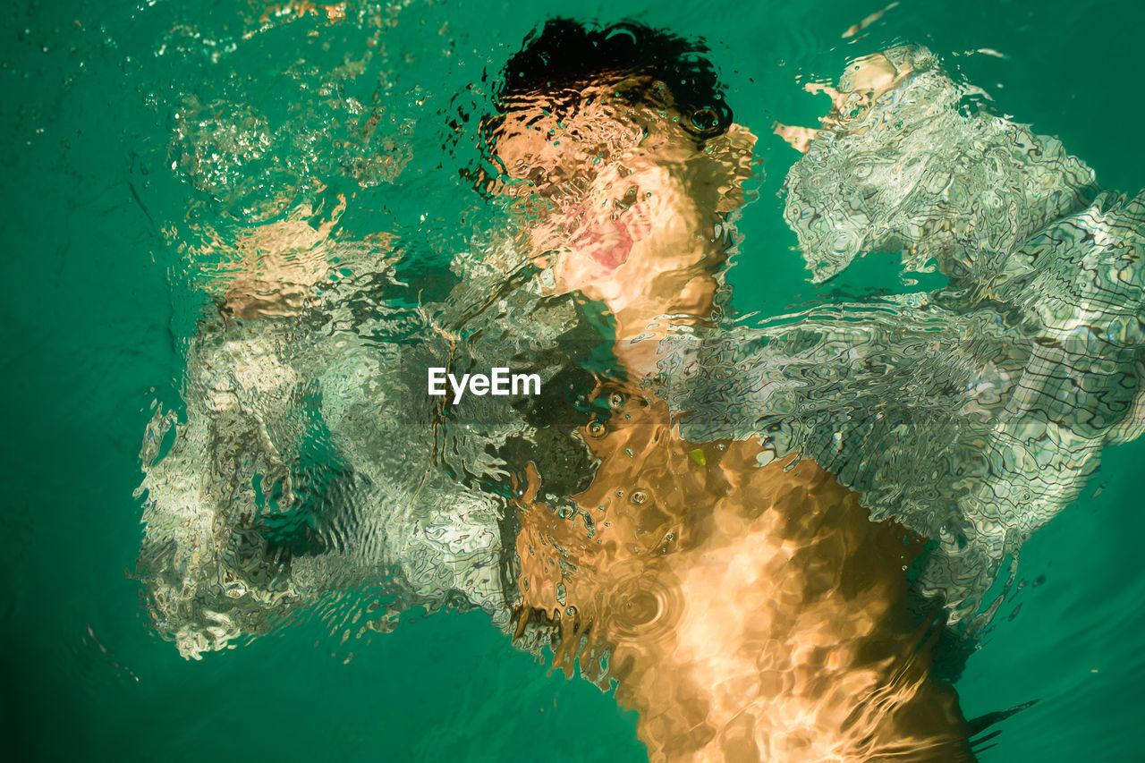 High angle view of person swimming in pool