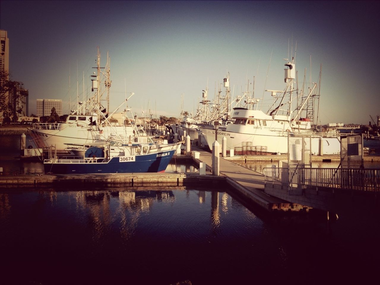 Boats moored on harbor