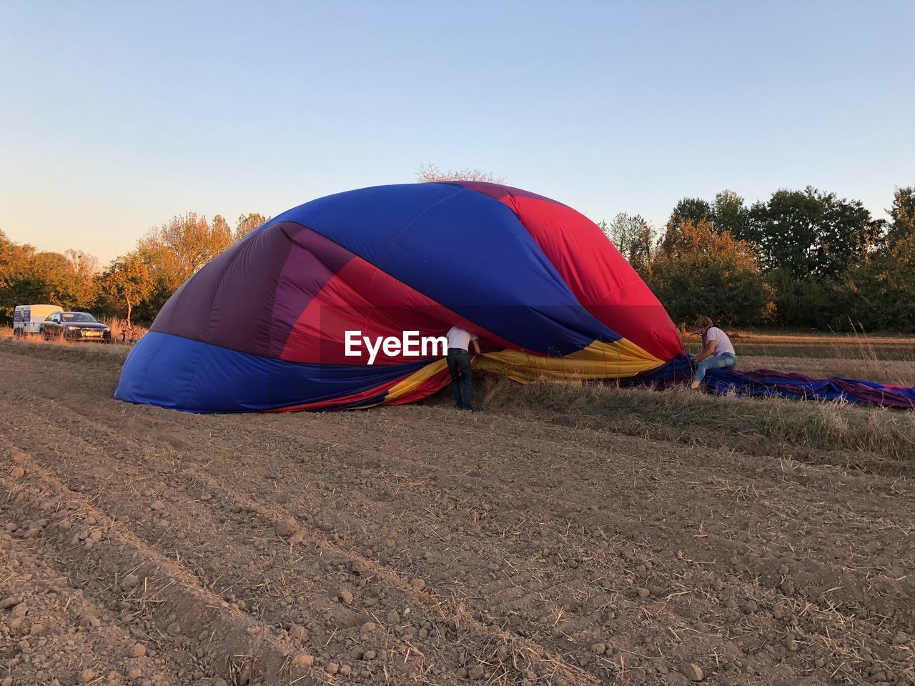 TENT ON FIELD AGAINST SKY