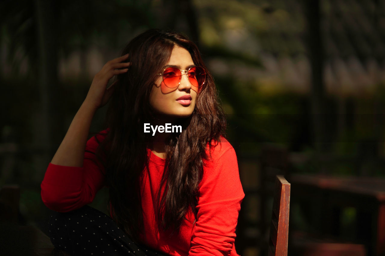 Portrait of young woman wearing sunglasses