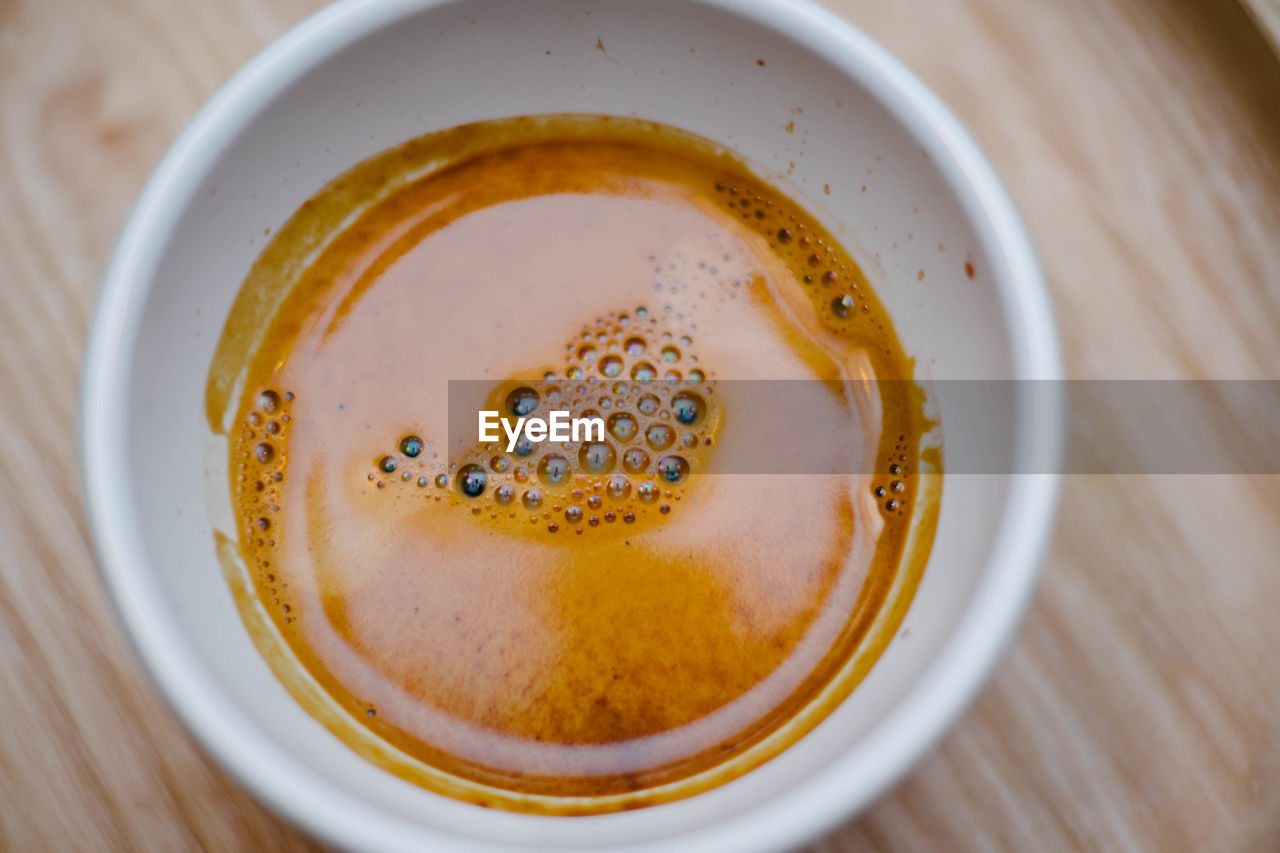 High angle view of coffee in cup on table