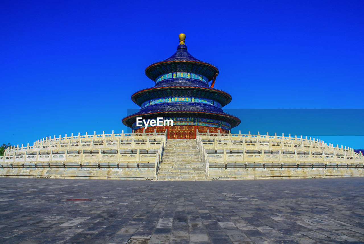 VIEW OF BUILDING AGAINST BLUE SKY