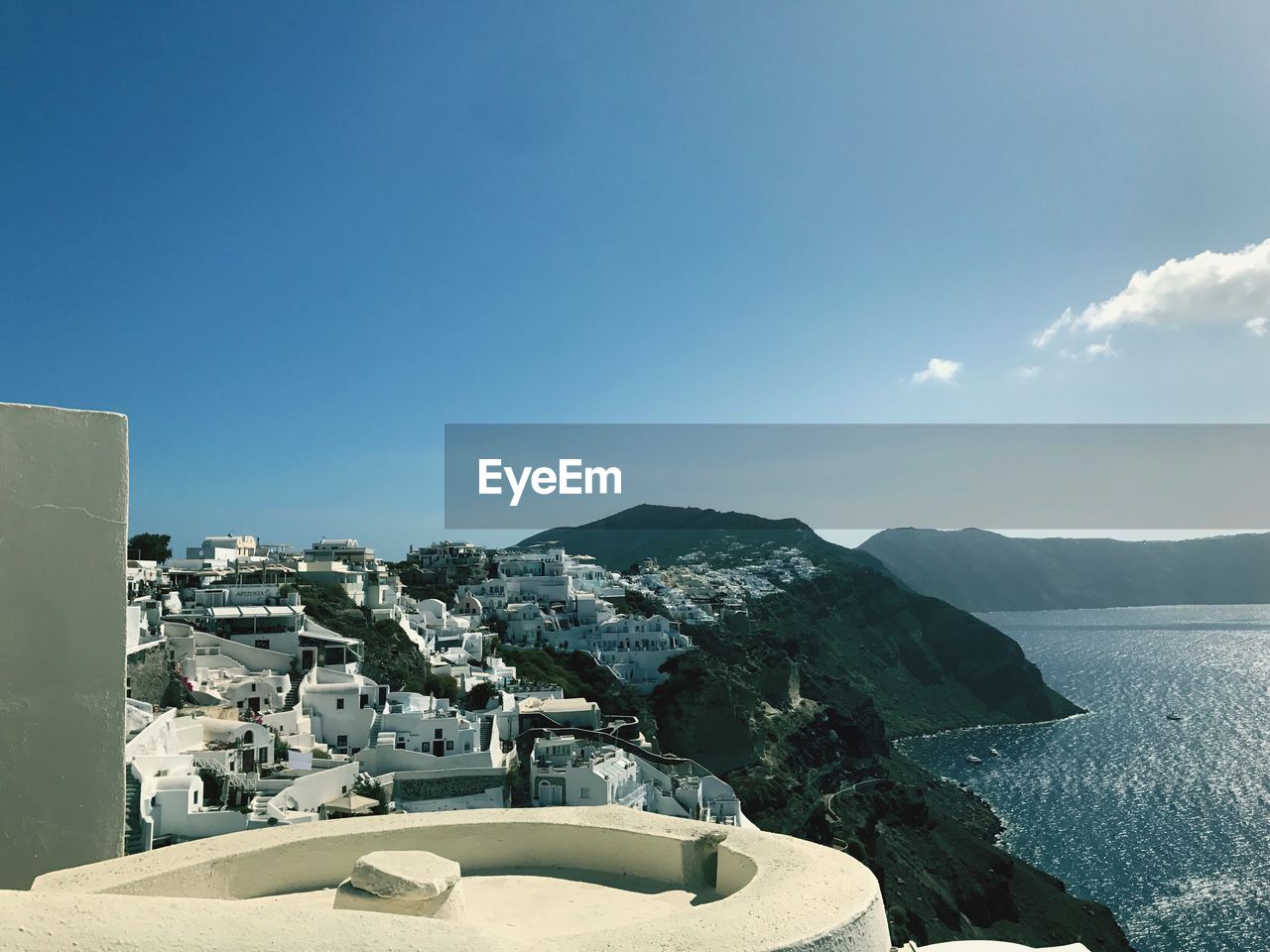 Scenic view of sea and buildings against sky