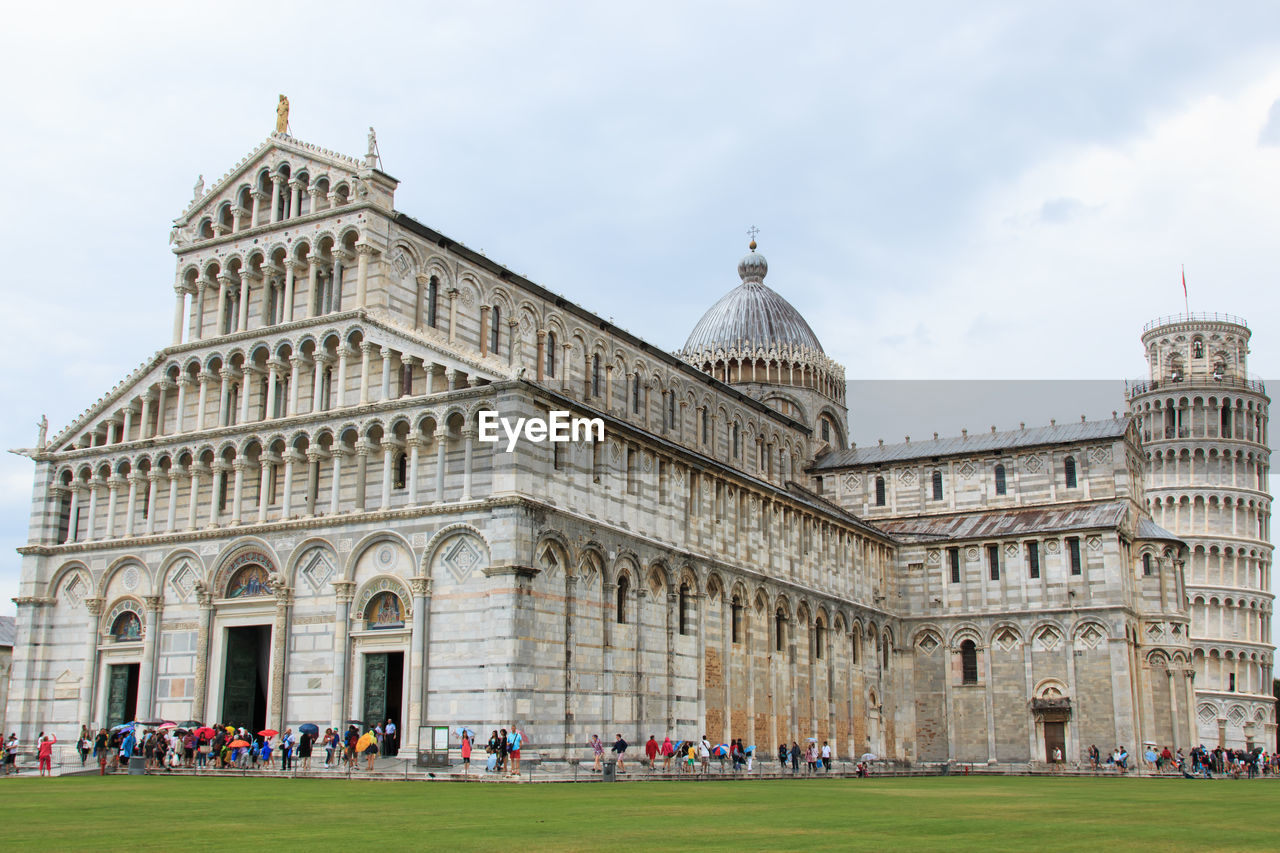 People at cathedral by leaning tower of pisa
