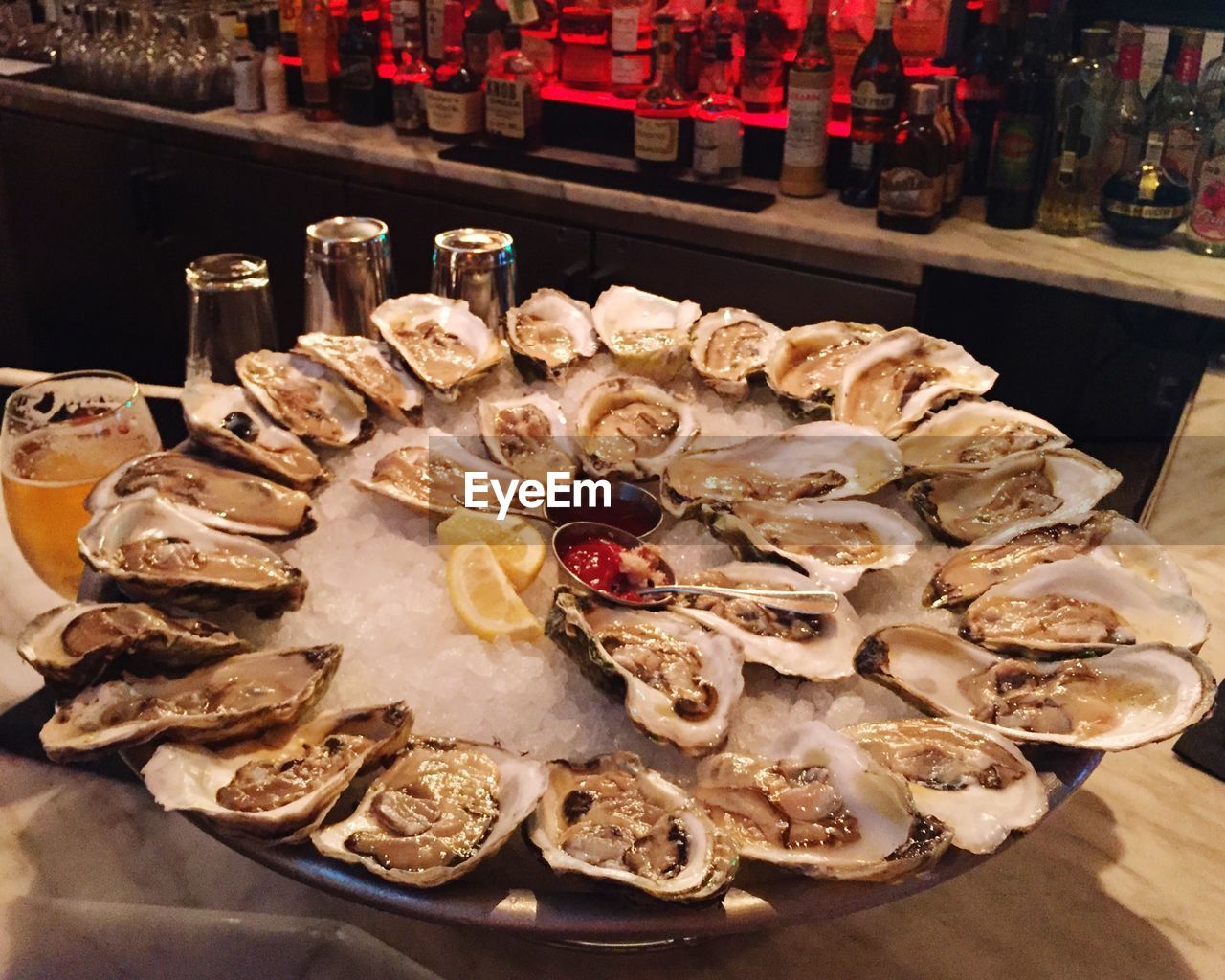 High angle view of oyster served on table in bar