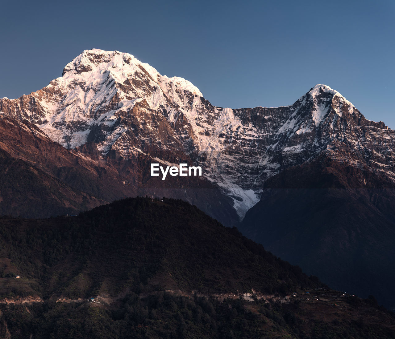 Annapurna south and hiunchuli mountain peaks  in himalayan mountains range in nepal