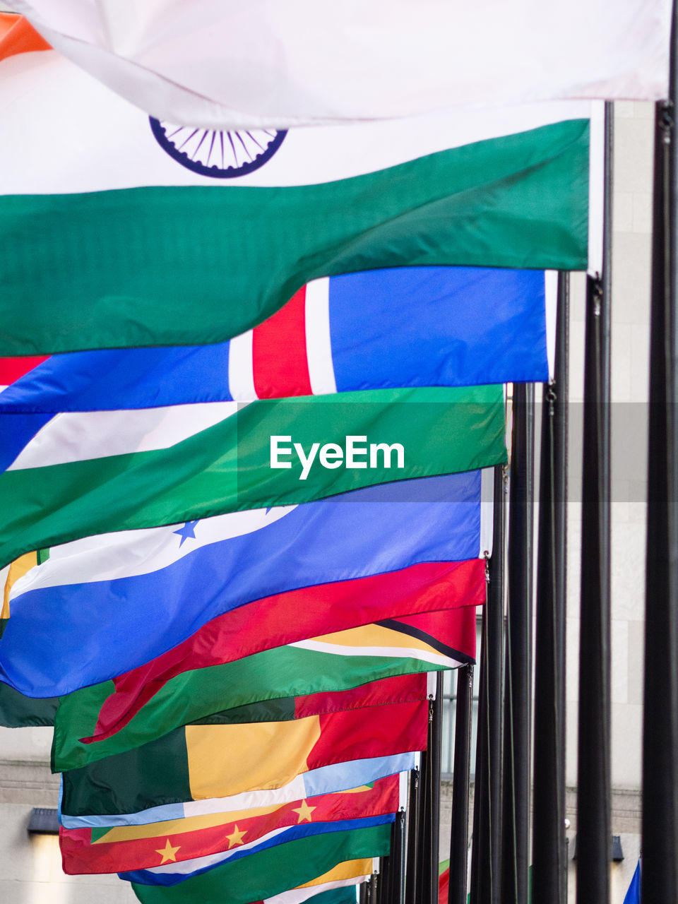 LOW ANGLE VIEW OF MULTI COLORED FLAG