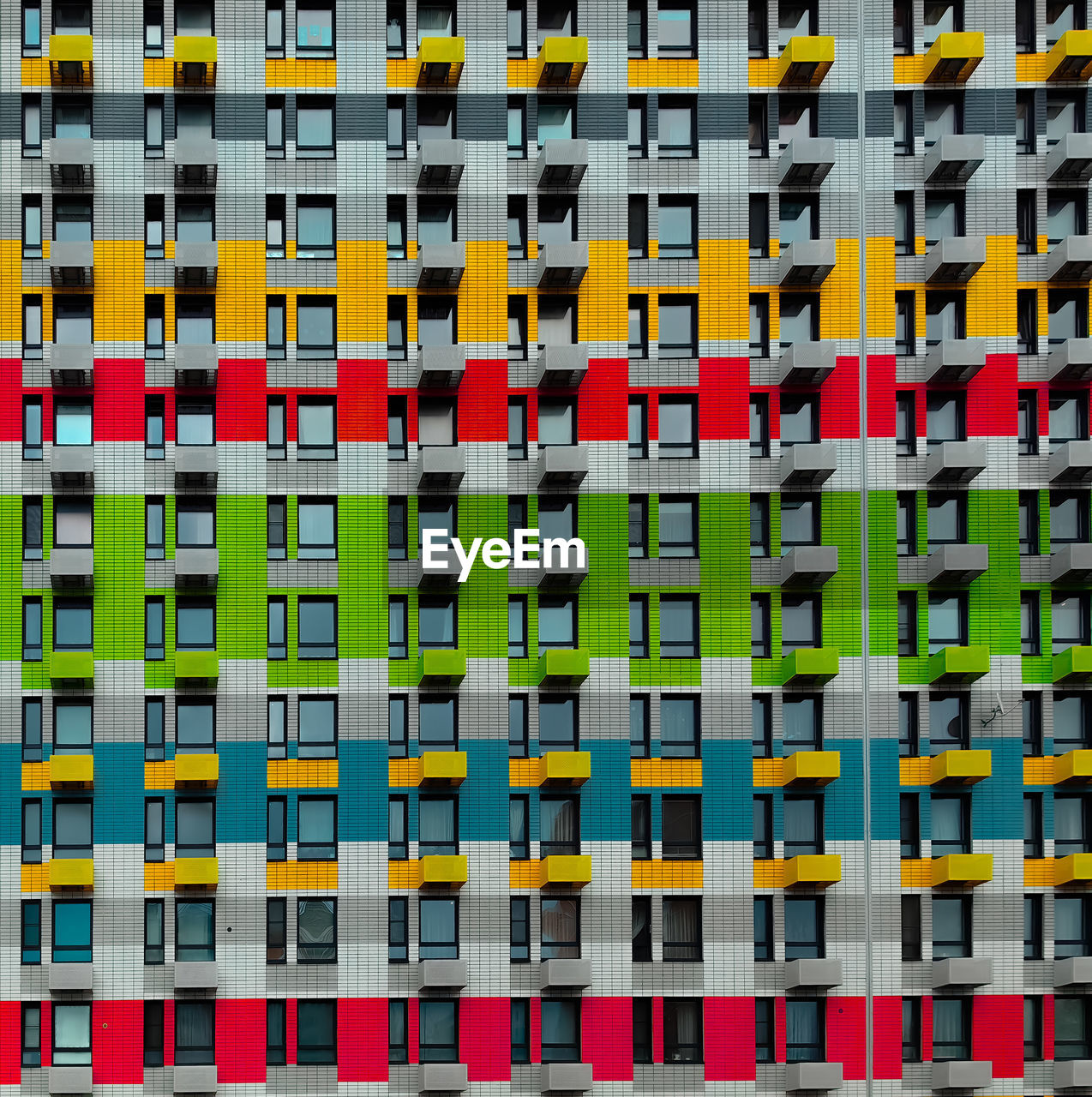 multi colored, architecture, in a row, line, full frame, large group of objects, no people, side by side, font, pattern, backgrounds, art, built structure, building exterior, yellow, order, repetition, city, variation, day, abundance, building, outdoors