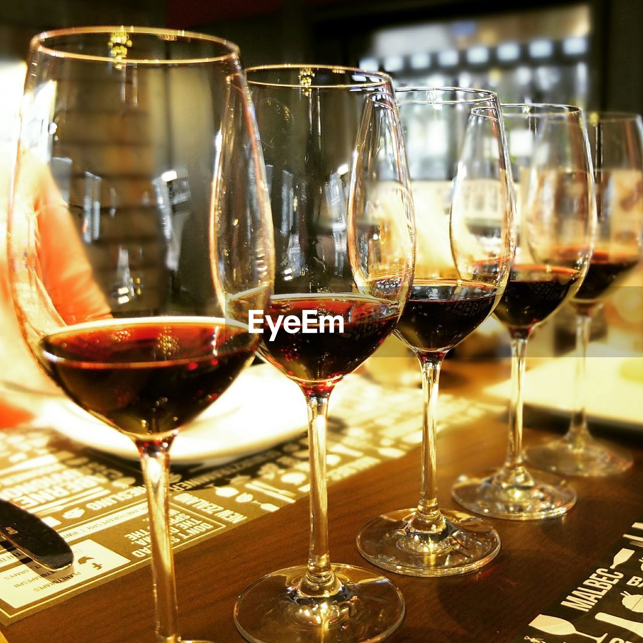 Close-up of wines served on table at restaurant