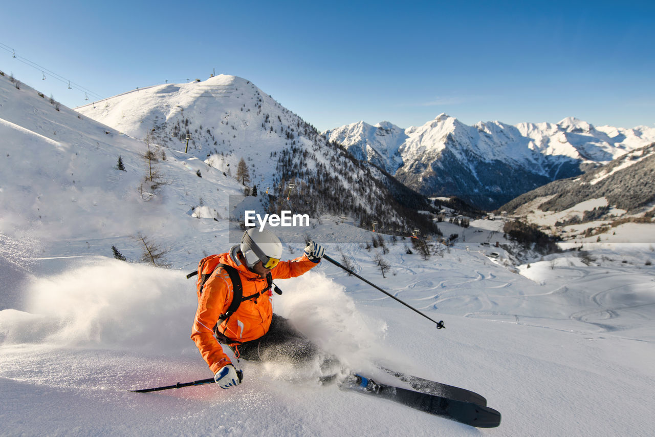 Free-rider skier in action in ski resort on the italian alps
