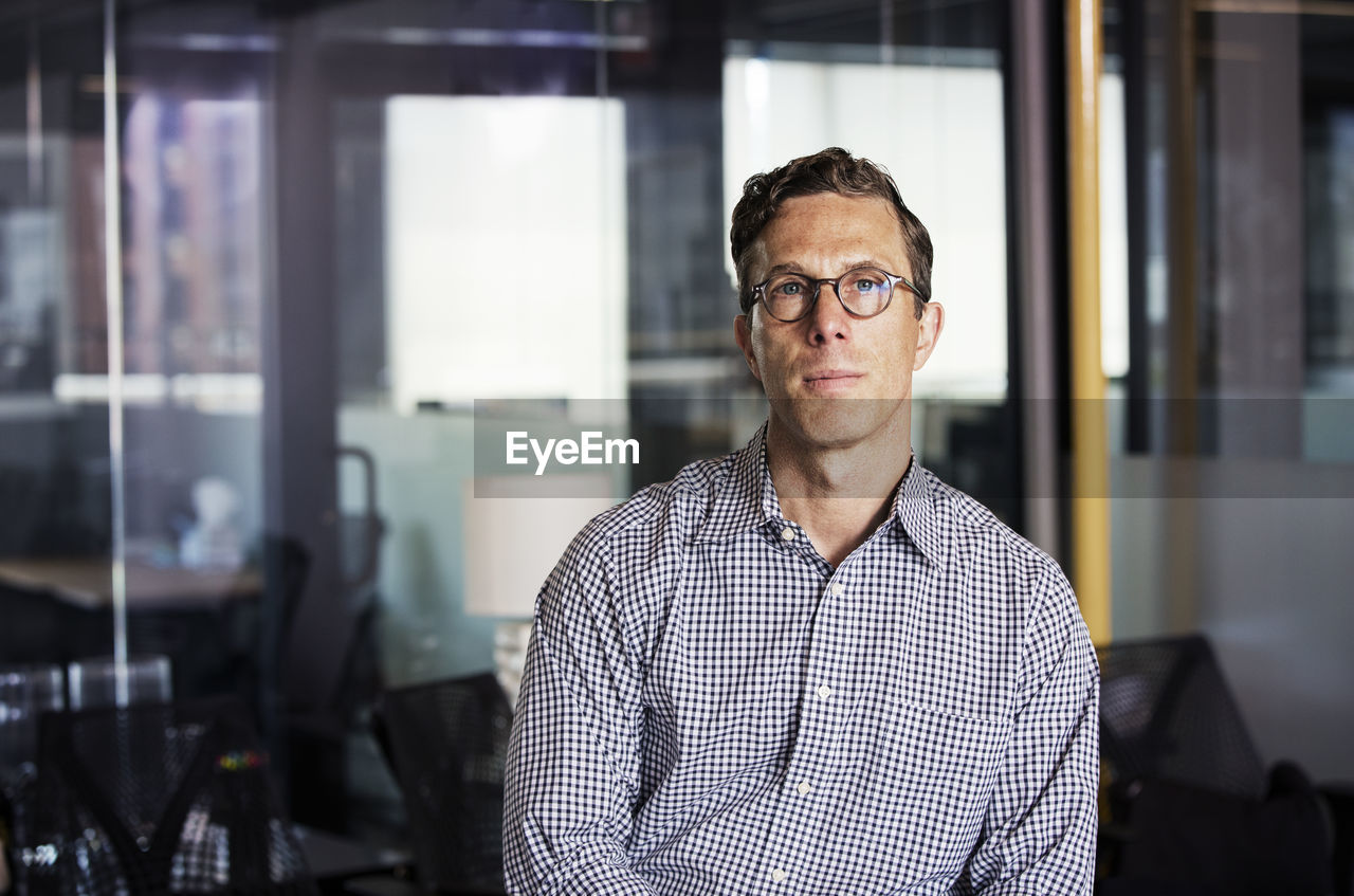 Portrait of businessman in office