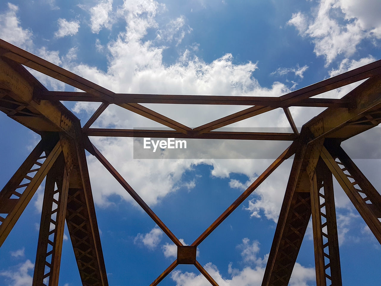 LOW ANGLE VIEW OF METALLIC STRUCTURE AGAINST SKY