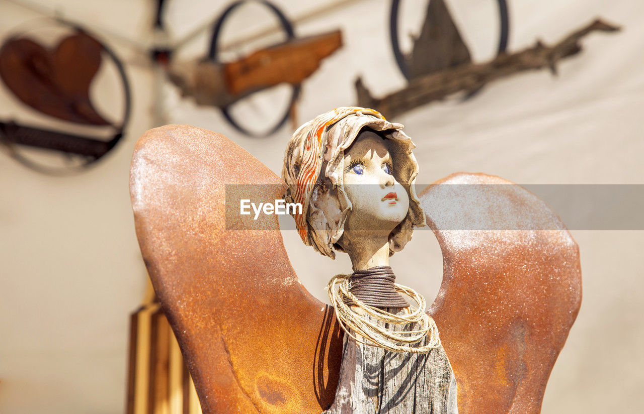 clothing, human head, brown, spring, person, footwear, human representation, focus on foreground, close-up, representation, indoors, human face, fashion